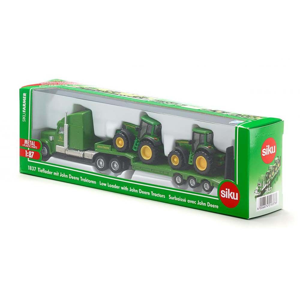 Тир влекач натоварен с два трактора John Deere