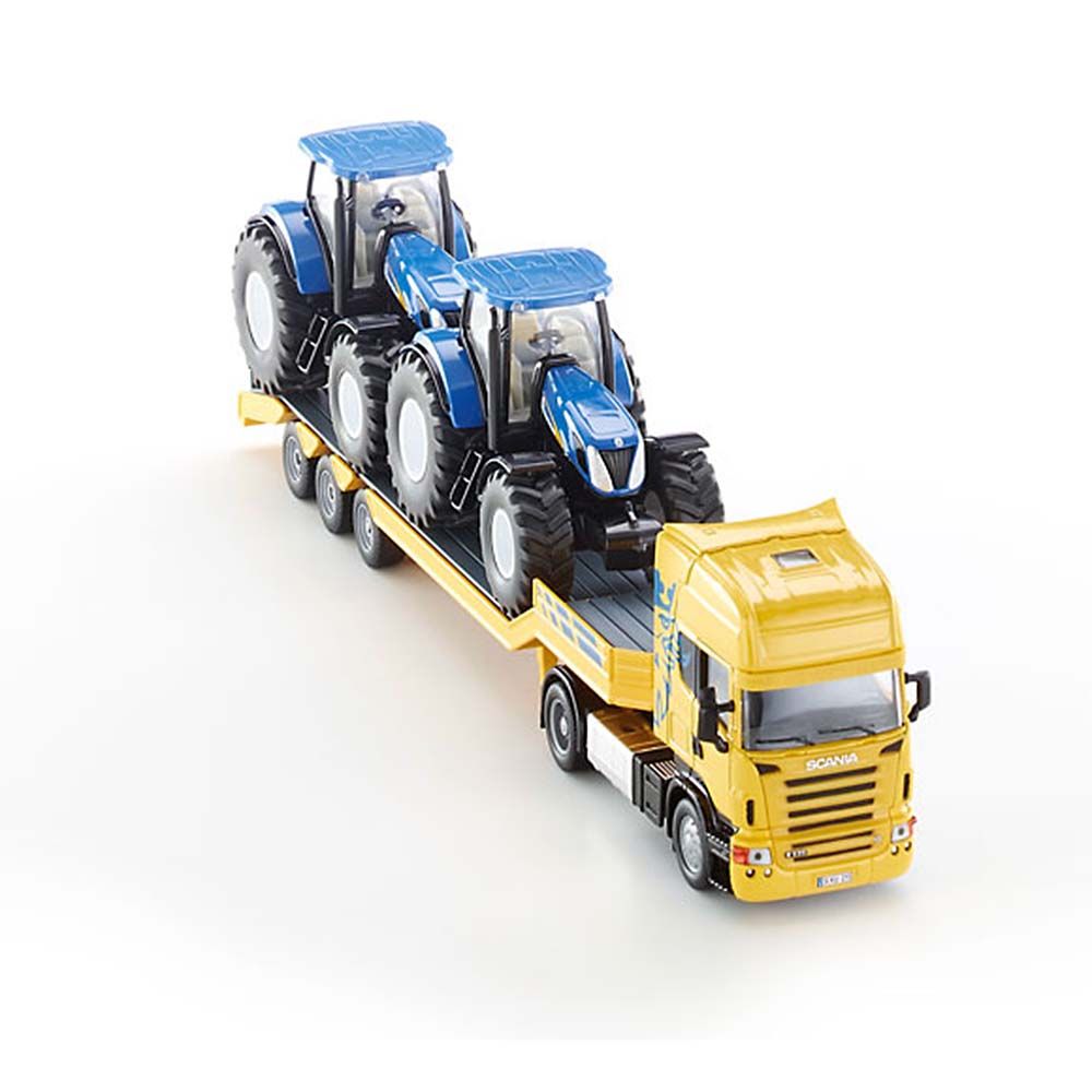 Тир влекач SCANIA натоварен с два трактора New Holland